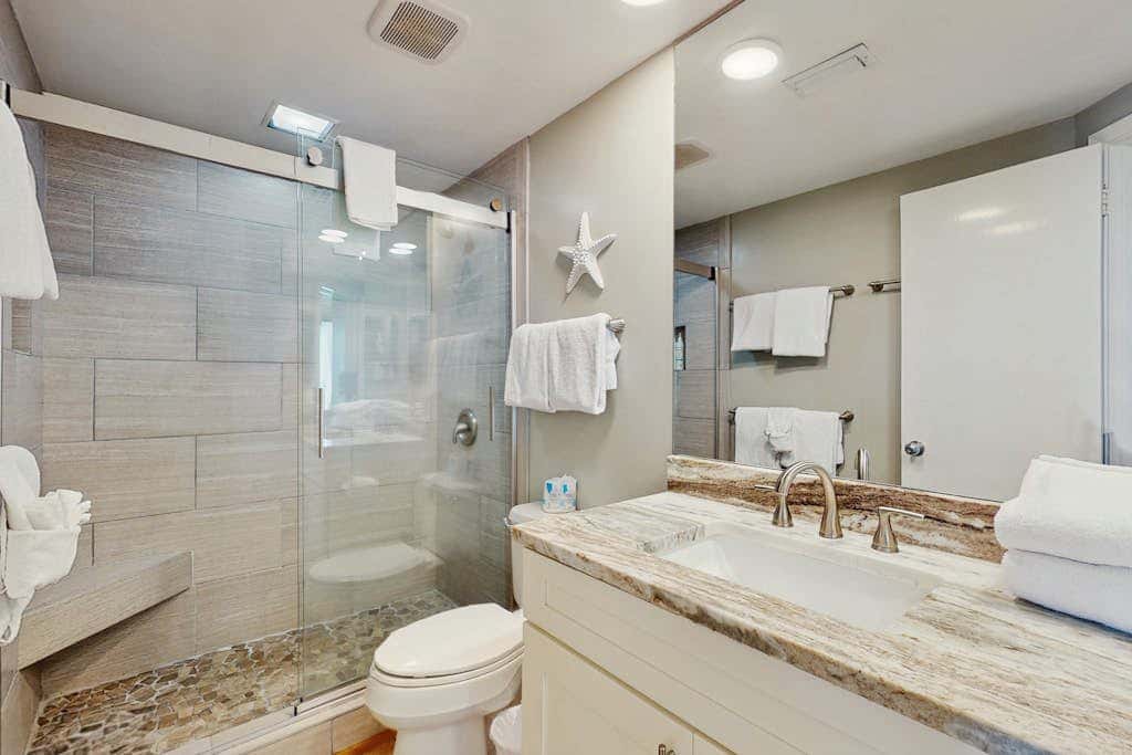Contemporary Gulf front condo with shared pools, hot tub, fitness center, beach
