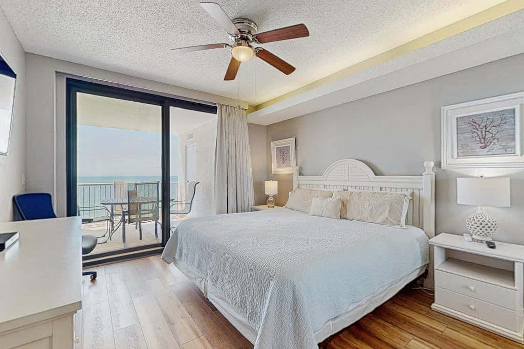 Contemporary Gulf front condo with shared pools, hot tub, fitness center, beach