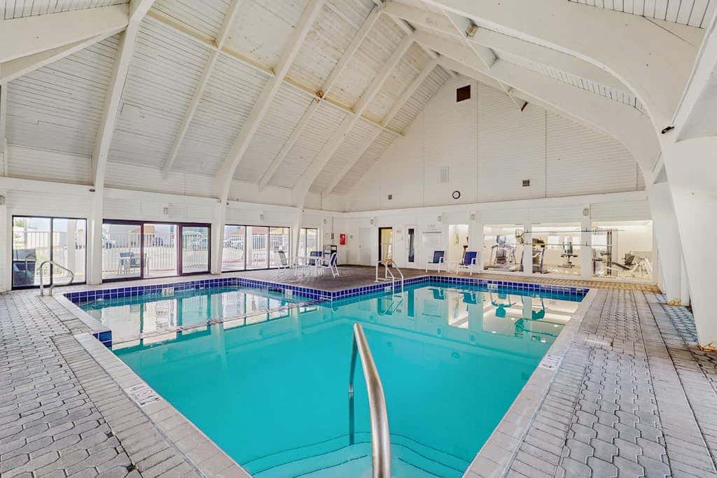 Contemporary Gulf front condo with shared pools, hot tub, fitness center, beach