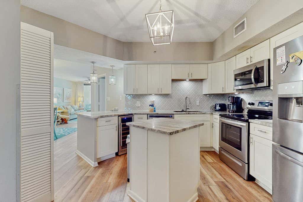 Contemporary Gulf front condo with shared pools, hot tub, fitness center, beach