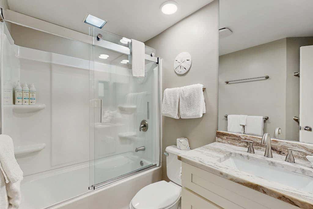 Contemporary Gulf front condo with shared pools, hot tub, fitness center, beach