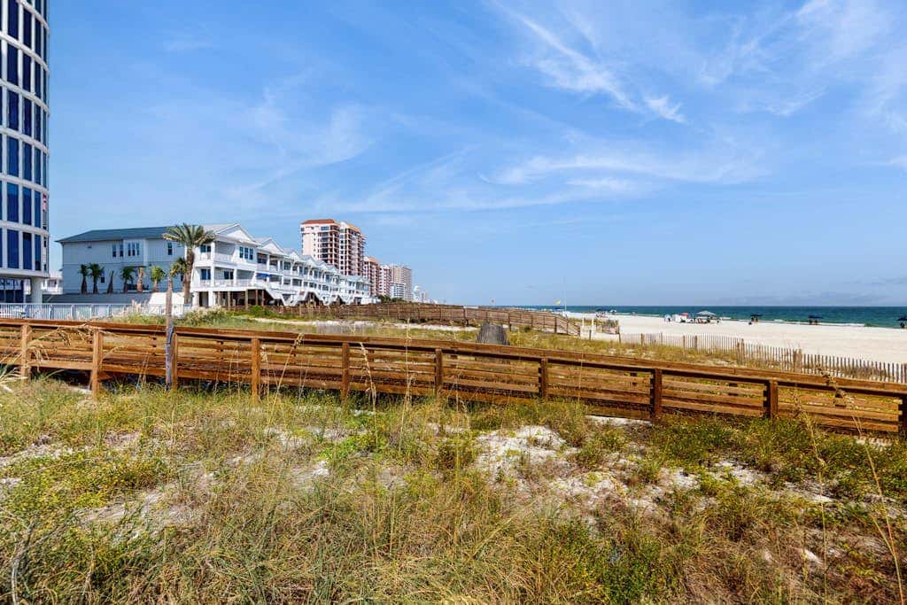 Contemporary Gulf front condo with shared pools, hot tub, fitness center, beach