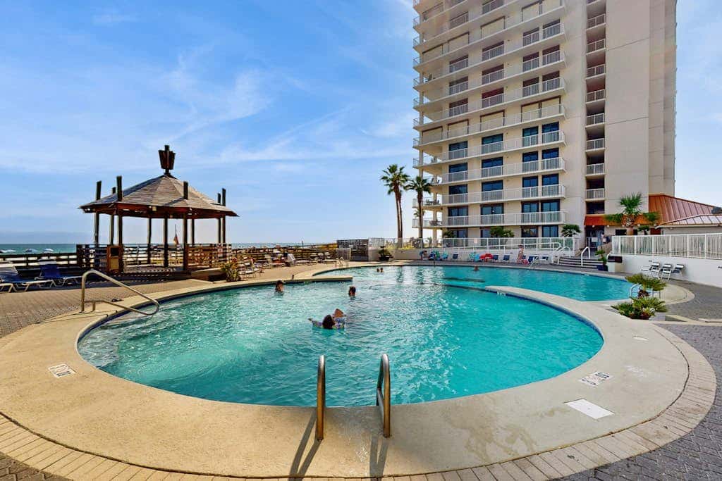 Contemporary Gulf front condo with shared pools, hot tub, fitness center, beach