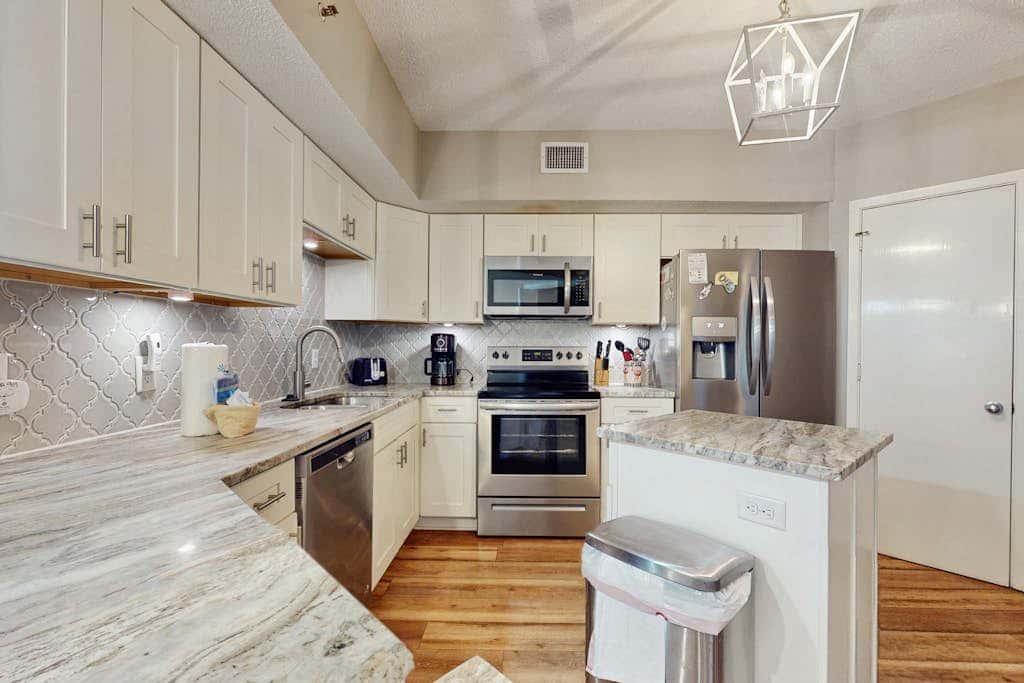 Contemporary Gulf front condo with shared pools, hot tub, fitness center, beach