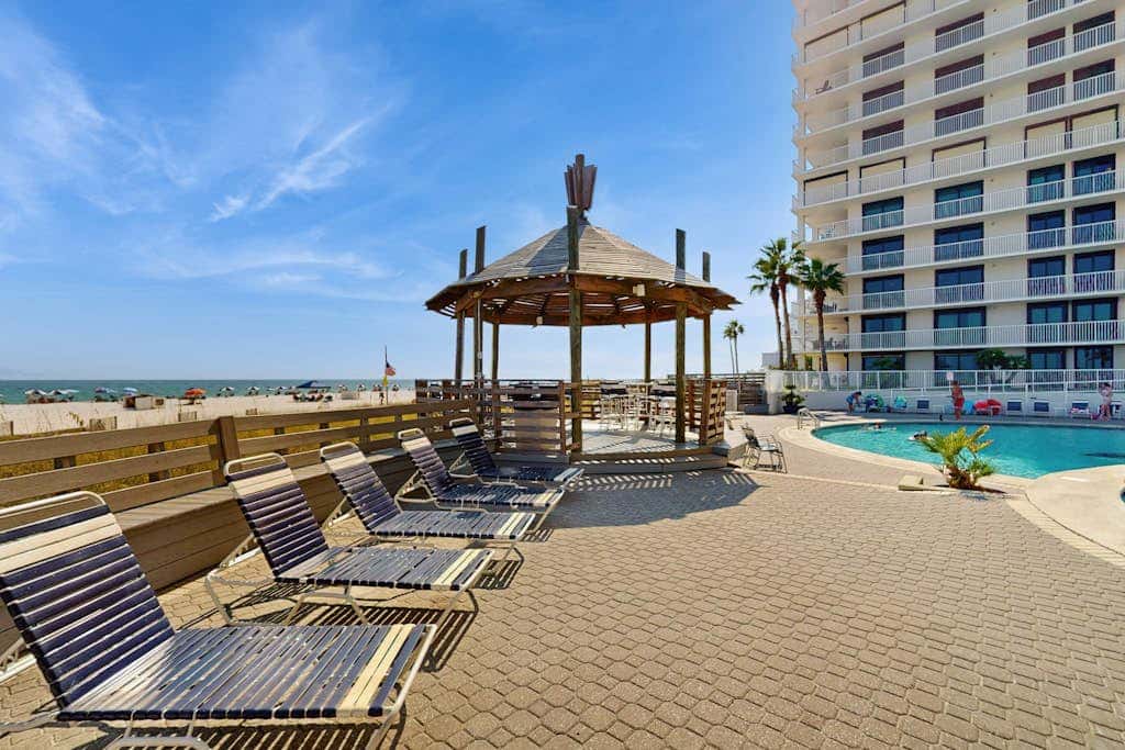 Contemporary Gulf front condo with shared pools, hot tub, fitness center, beach