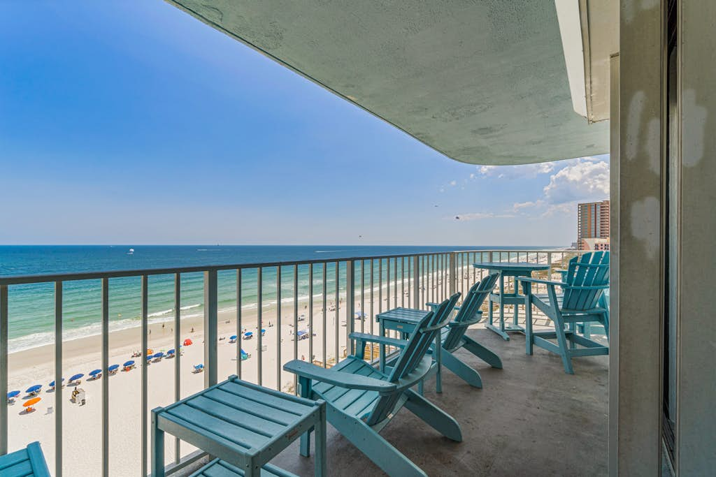 Stunning beachfront condo with a full kitchen, private balcony, & shared pools