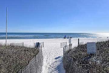 Gulf front condo with onsite snack bar, three shared pools, and internet