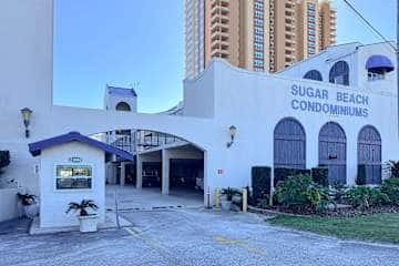 Gulf front condo with onsite snack bar, three shared pools, and internet