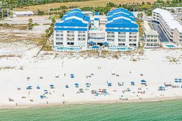 Gulf front condo with onsite snack bar, three shared pools, and internet