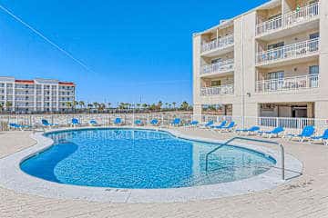 Gulf front condo with onsite snack bar, three shared pools, and internet