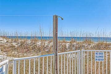 Gulf front condo with onsite snack bar, three shared pools, and internet