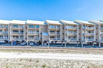 Gulf front condo with onsite snack bar, three shared pools, and internet
