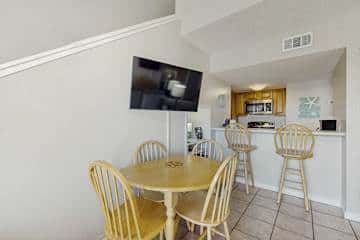 Gulf front condo with onsite snack bar, three shared pools, and internet