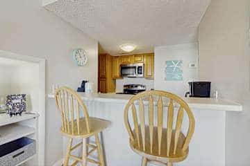 Gulf front condo with onsite snack bar, three shared pools, and internet