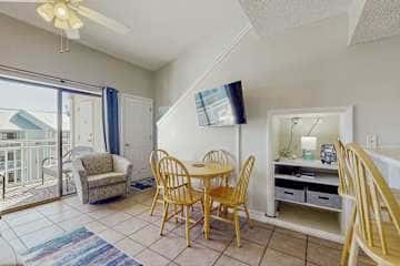 Gulf front condo with onsite snack bar, three shared pools, and internet