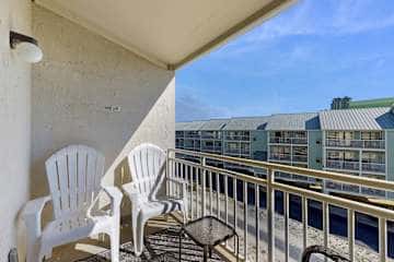 Gulf front condo with onsite snack bar, three shared pools, and internet
