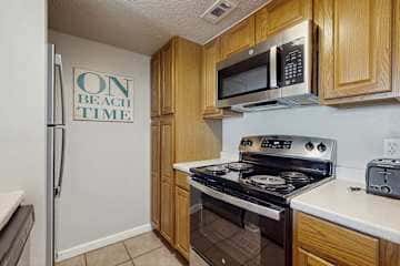 Gulf front condo with onsite snack bar, three shared pools, and internet