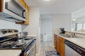Gulf front condo with onsite snack bar, three shared pools, and internet