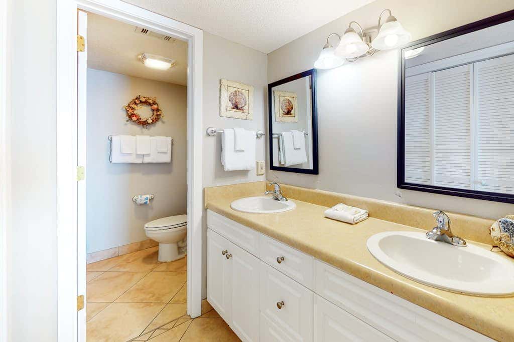 Two-story, Gulf-front condo with a pool, WiFi, washer,dryer, & central AC