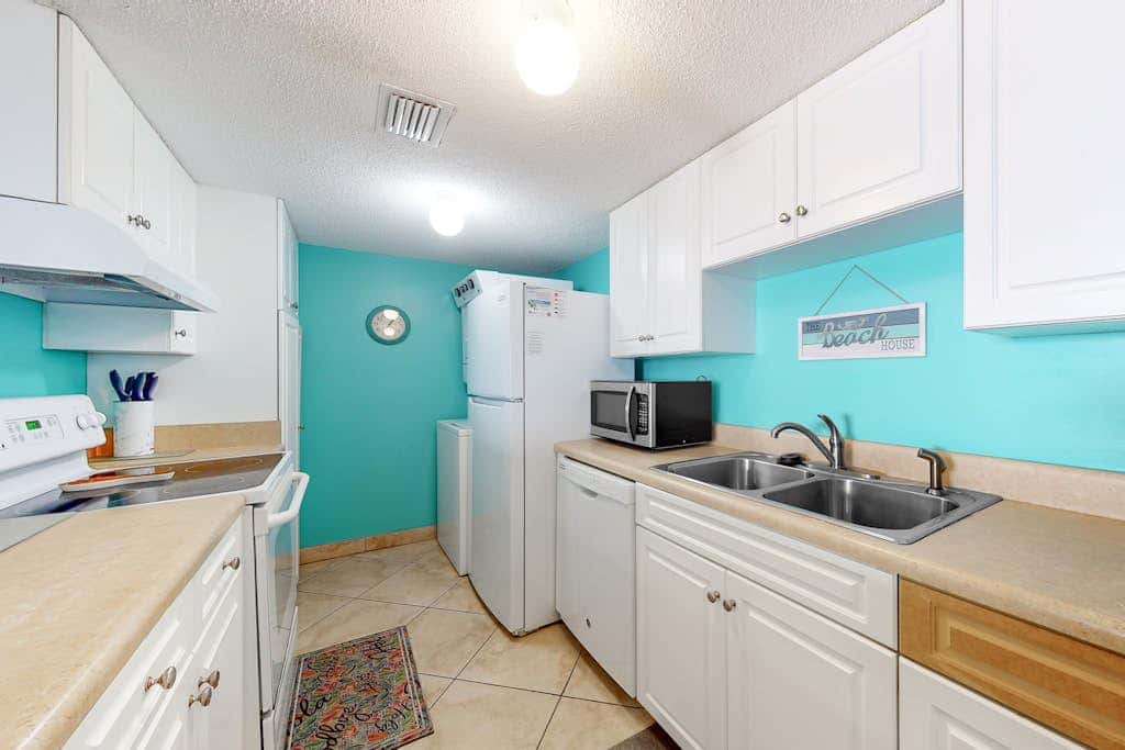 Two-story, Gulf-front condo with a pool, WiFi, washer,dryer, & central AC
