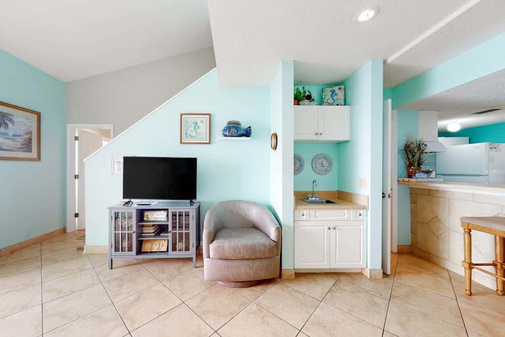 Two-story, Gulf-front condo with a pool, WiFi, washer,dryer, & central AC