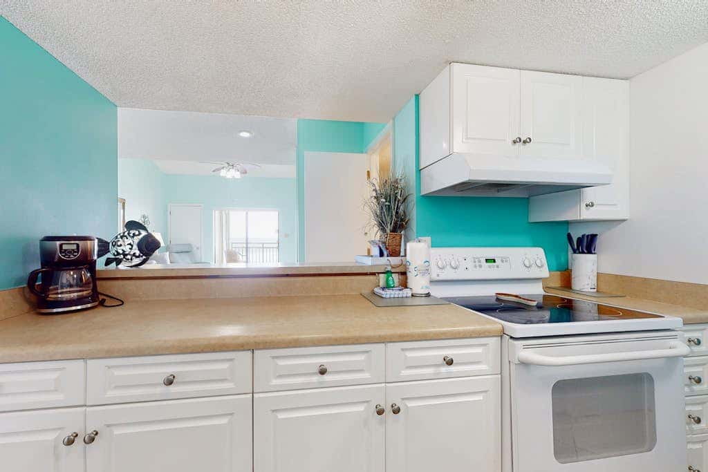 Two-story, Gulf-front condo with a pool, WiFi, washer,dryer, & central AC