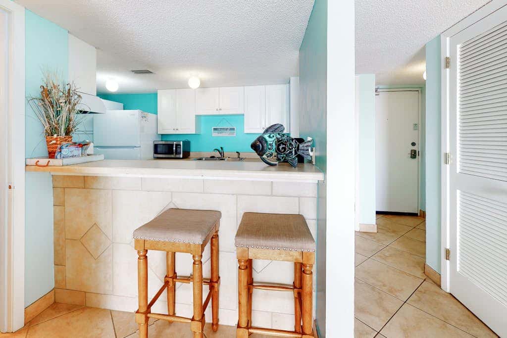 Two-story, Gulf-front condo with a pool, WiFi, washer,dryer, & central AC