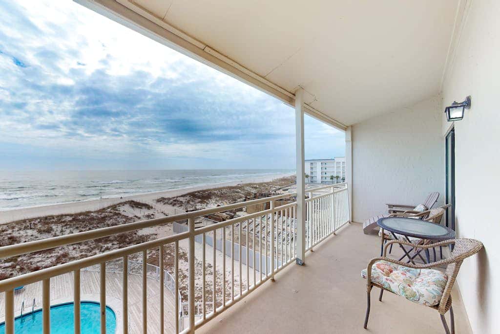 Two-story, Gulf-front condo with a pool, WiFi, washer,dryer, & central AC
