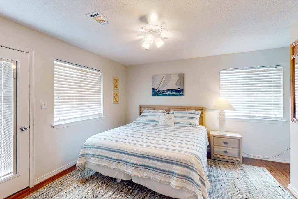 Duplex home with two-level deck, beach access, hot tub, & balcony