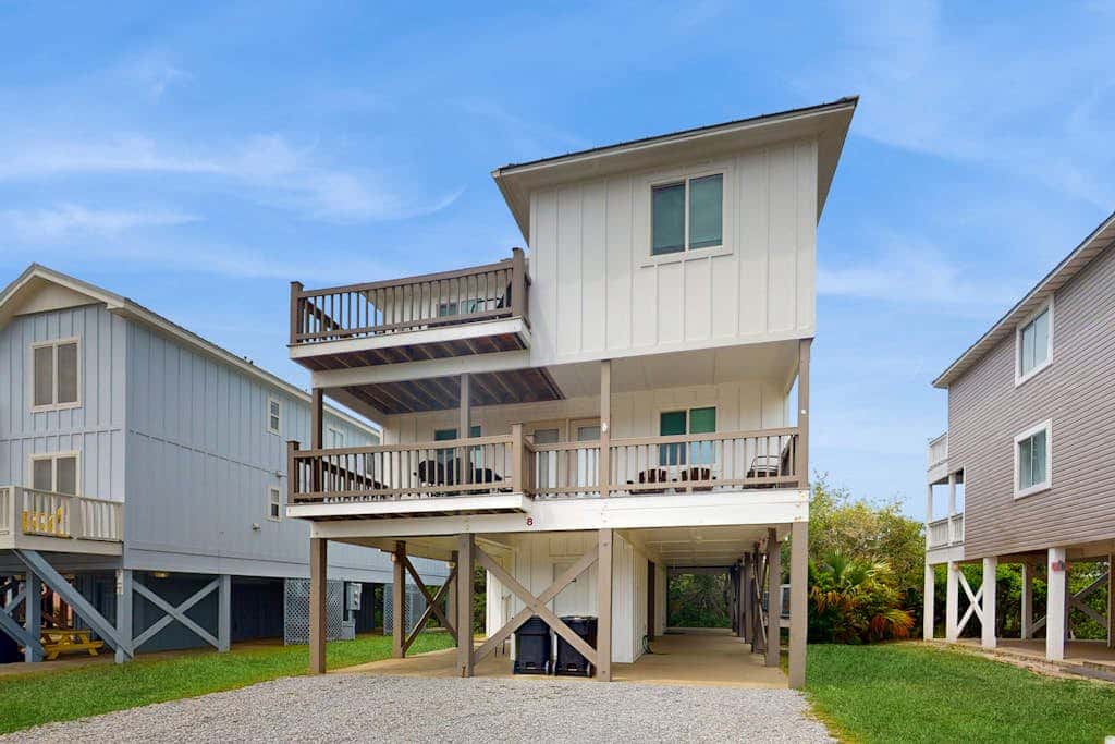 Duplex home with two-level deck, beach access, hot tub, & balcony