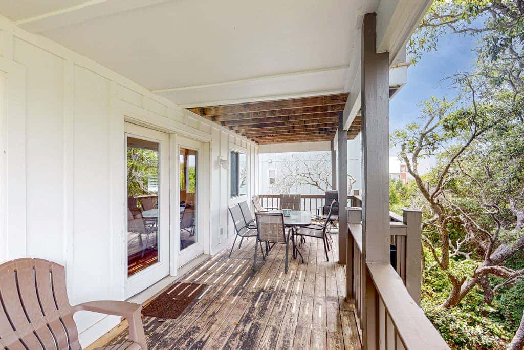 Gulf view home with two-level deck, beach access & shared pools, hot tub, gym