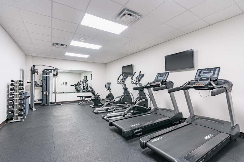 Third-floor condo with pool, hot tub, partial ocean view, gym, & central AC