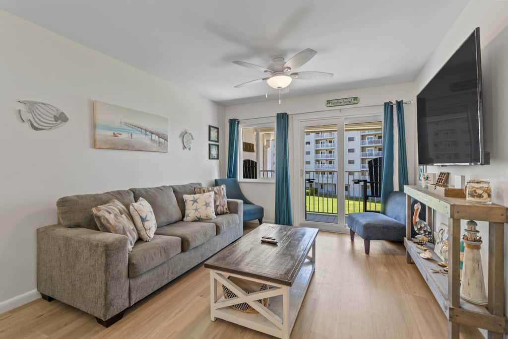 Third-floor condo with pool, hot tub, partial ocean view, gym, & central AC