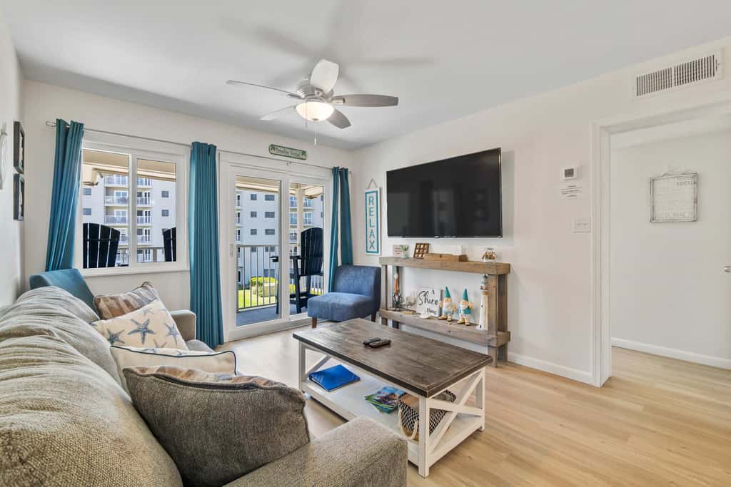 Third-floor condo with pool, hot tub, partial ocean view, gym, & central AC