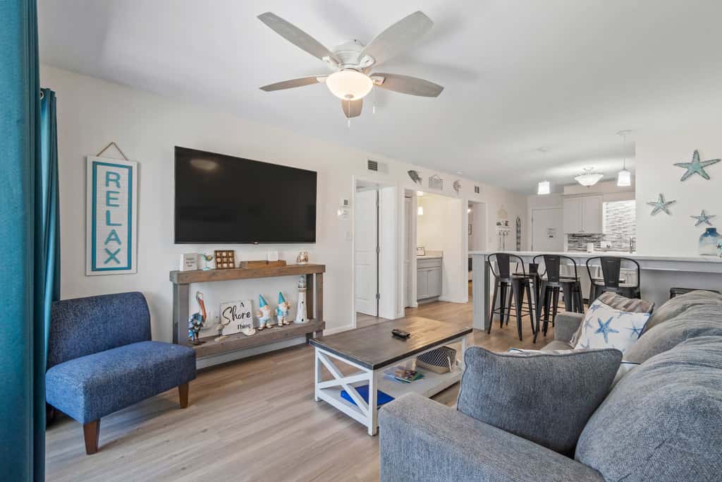 Third-floor condo with pool, hot tub, partial ocean view, gym, & central AC