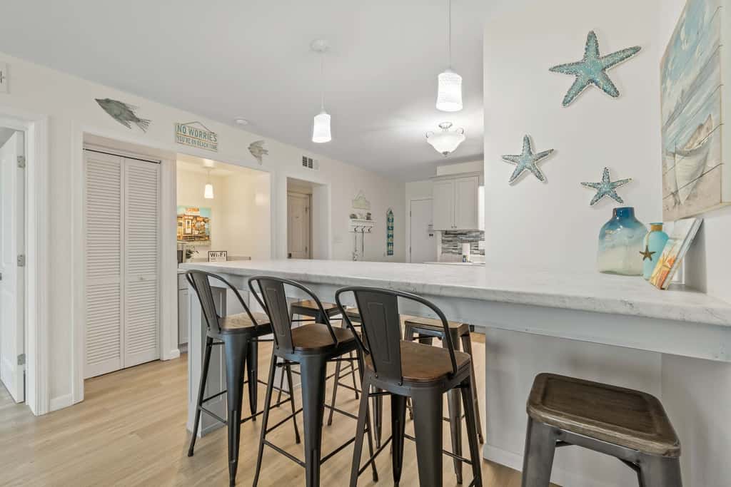 Third-floor condo with pool, hot tub, partial ocean view, gym, & central AC