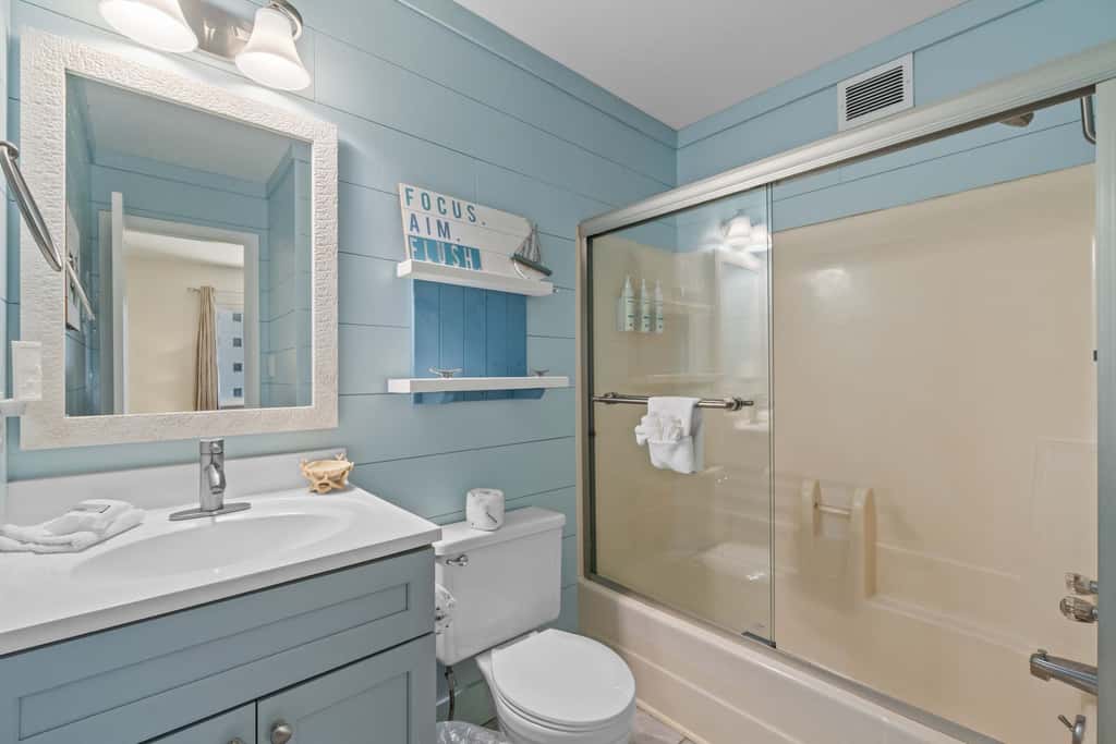 Third-floor condo with pool, hot tub, partial ocean view, gym, & central AC