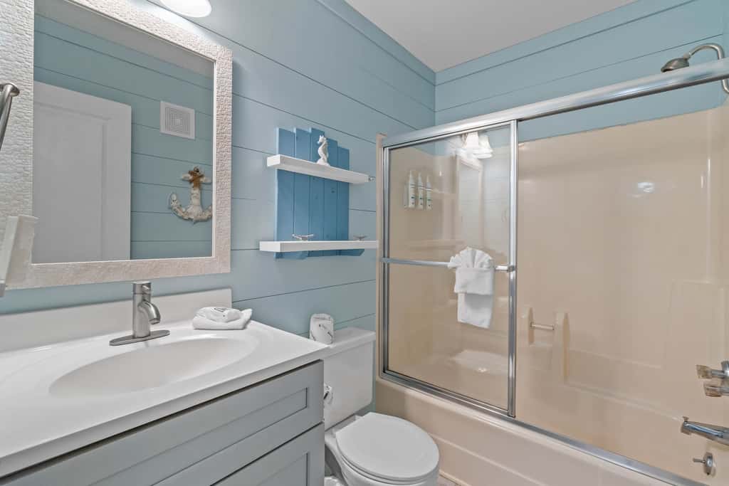 Third-floor condo with pool, hot tub, partial ocean view, gym, & central AC