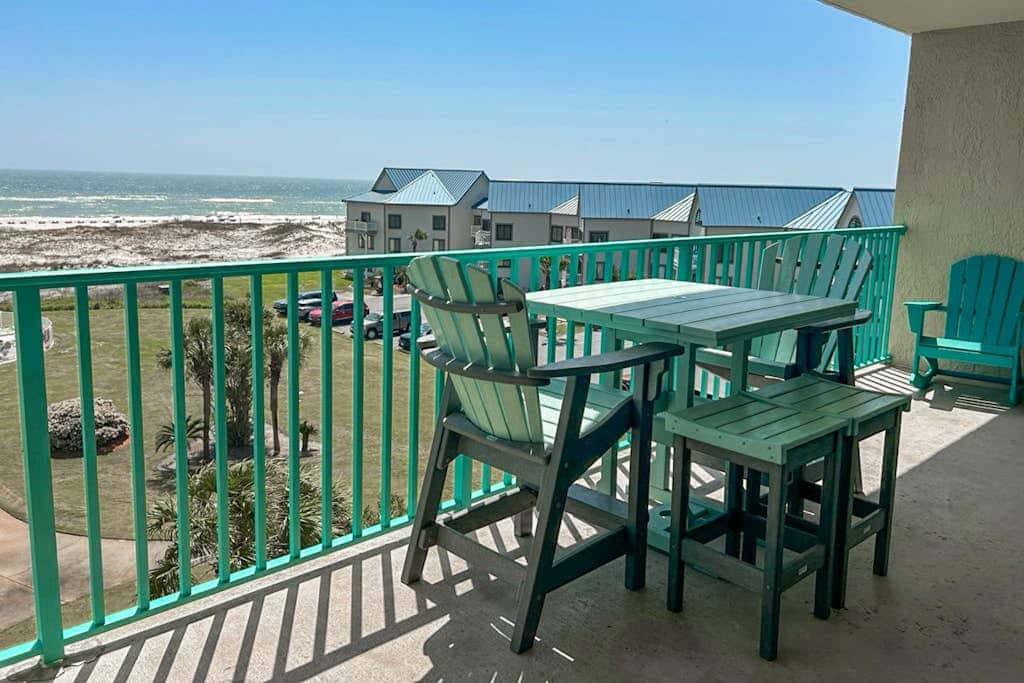 Oceanfront condo with Gulf-view balcony, beach access, pool, WiFi, & central AC