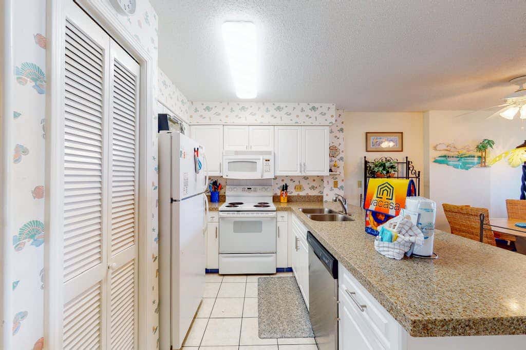 Oceanfront condo with Gulf-view balcony, beach access, pool, WiFi, & central AC