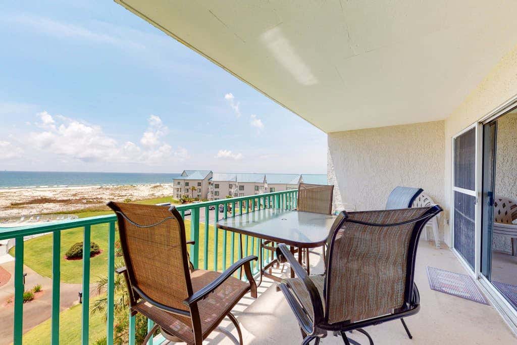 Oceanfront condo with Gulf-view balcony, beach access, pool, WiFi, & central AC