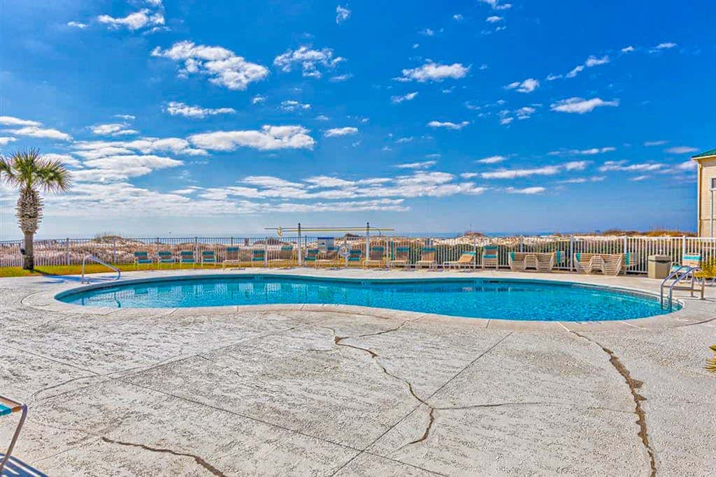 Oceanfront condo with Gulf-view balcony, beach access, pool, WiFi, & central AC