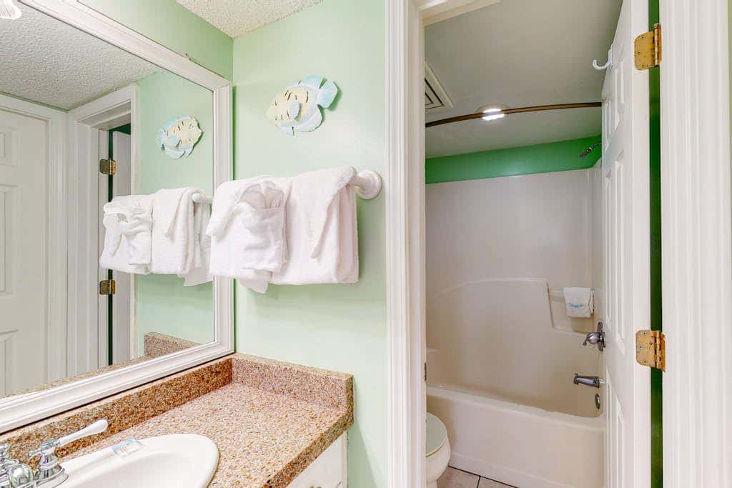 Oceanfront condo with Gulf-view balcony, beach access, pool, WiFi, & central AC