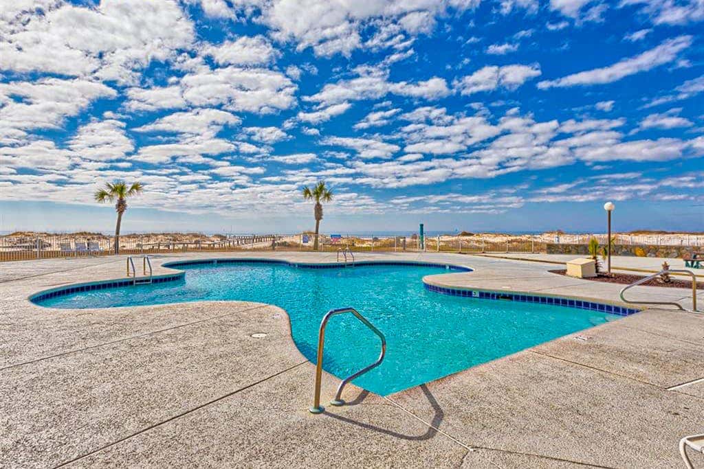 Oceanfront condo with Gulf-view balcony, beach access, pool, WiFi, & central AC