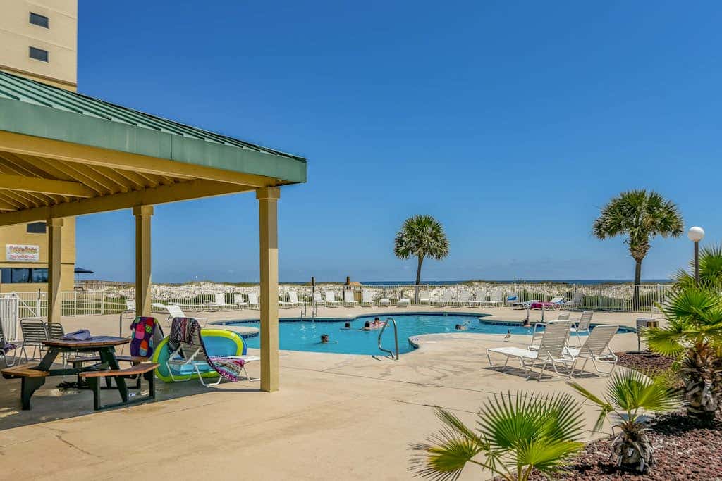 Oceanfront condo with Gulf-view balcony, beach access, pool, WiFi, & central AC