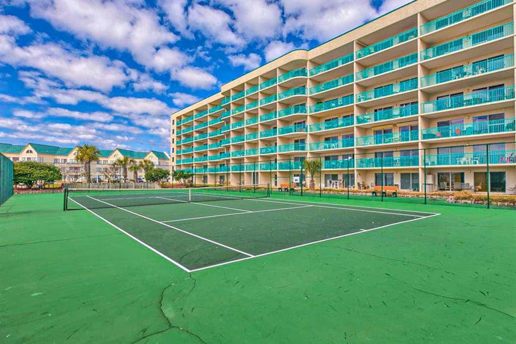 Oceanfront condo with Gulf-view balcony, beach access, pool, WiFi, & central AC