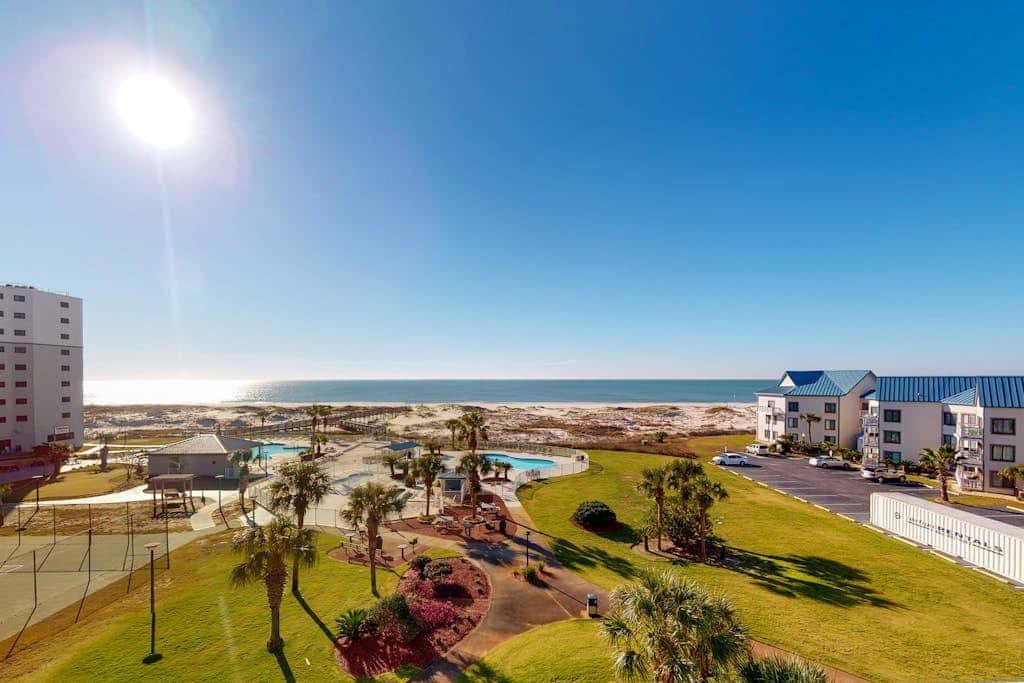 Oceanfront condo with Gulf-view balcony, beach access, pool, WiFi, & central AC