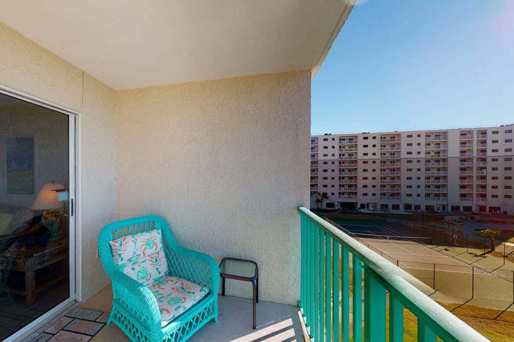 Oceanfront condo with Gulf-view balcony, beach access, pool, WiFi, & central AC