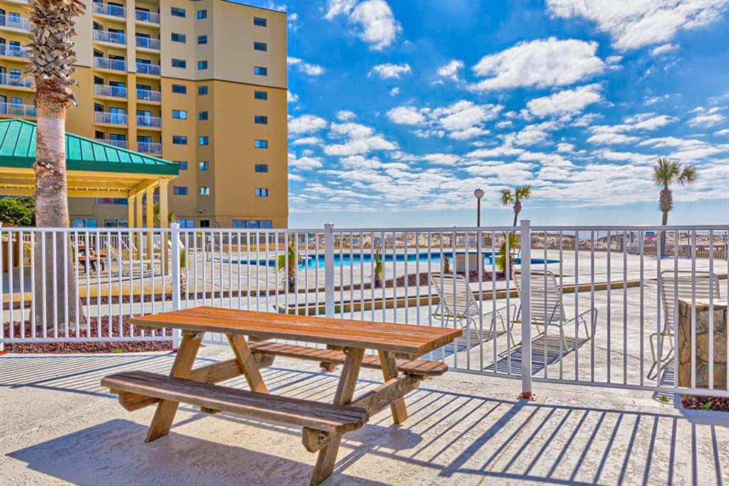Oceanfront condo with Gulf-view balcony, beach access, pool, WiFi, & central AC