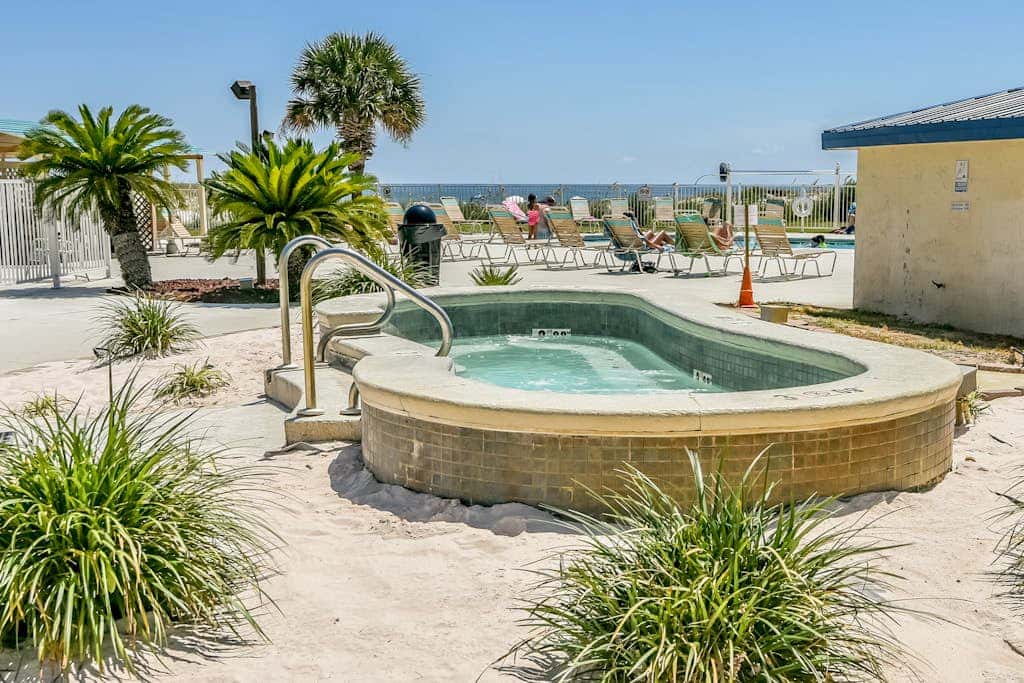 Oceanfront condo with Gulf-view balcony, beach access, pool, WiFi, & central AC